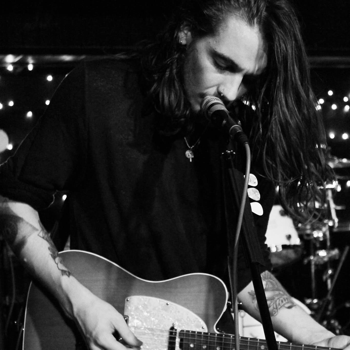 Jason performing guitar